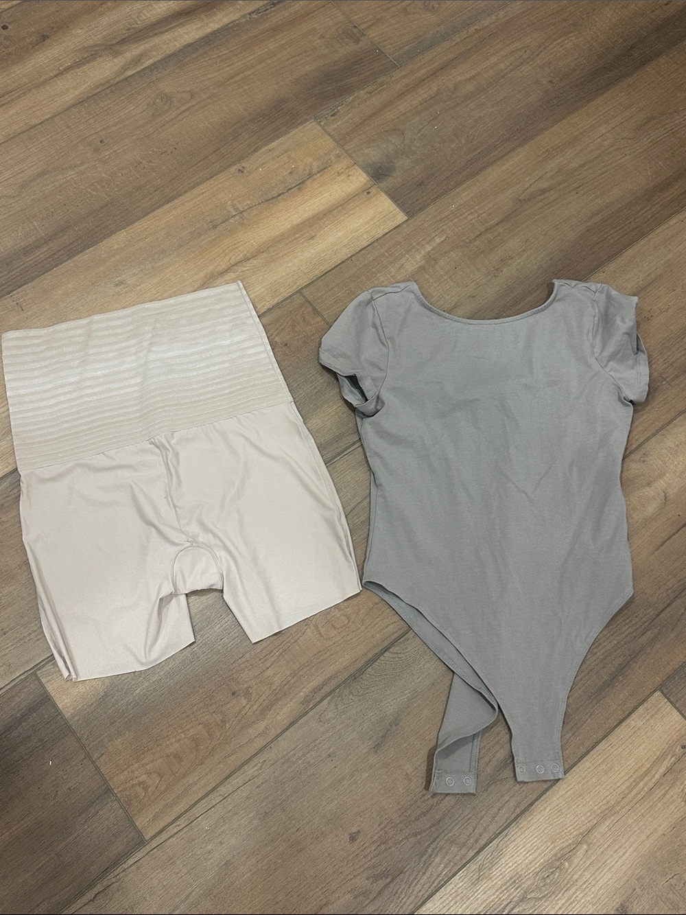 Divided beige shapewear shorts and gray bodysuit